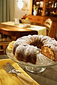 An Apple Spice Bundt Cake on a Glass Cake Stand at Home
