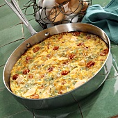 Salmon frittata with cherry tomatoes and spring onions