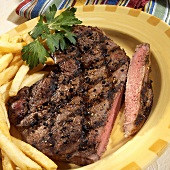 Grilled peppered steak with chips