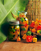 Mixed chili peppers in preserving jars