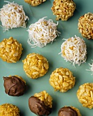 Rows of Peanut Butter Balls, Rolled in Coconut, Rice Krispies, Nuts and Chocolate