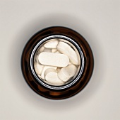 An Opened Pill Bottle from Overhead