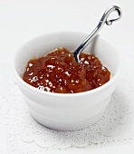 Orange Marmalade with a Spoon in a White Bowl