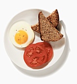 A Poached Egg with Tomato and Toast