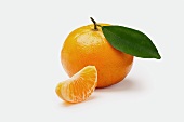 A Whole Mandarine Orange with Segment on White