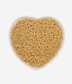 O-shaped Cereal in a Heart Shaped Bowl