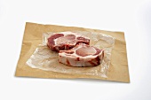 Two Raw Pork Chops on Butcher's Paper