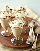Glasses of Pumpkin-Hazelnut Mousse on a Round Wooden Tray