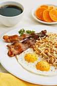 Fried Eggs with Bacon and Shredded Homefried Potatoes