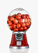 Red Apples in a Candy Dispenser