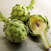 Two Whole and One Halved Artichoke