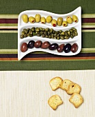 Capers, Green and Black Olives with Crackers