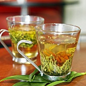 Two Glass Mugs of Flowering Tea