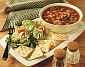 Vegetable soup with salad and crackers