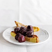 French Toast Topped with Cherries and Powdered Sugar