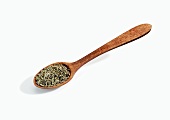 Wooden Spoonful of Whole Cumin Seeds on White Background