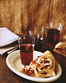 Slice of Homemade Pizza with Onions and Walnuts on Plate with Beverage