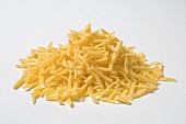 Grated cheese on white background