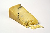 Slice of blue cheese on white background