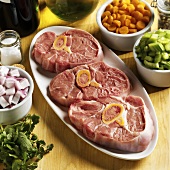 Ingredients for osso buco (veal shank slices & vegetables)