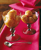 Orange ice cream in two dessert glasses
