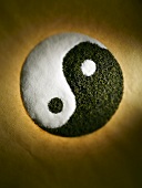 Yin and Yang Sign Made From White Sugar and Black Tea, Overhead