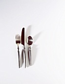 Set of Silver Ware on White Shot From Above