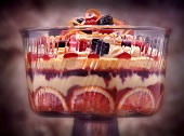 A layered dessert with shortbread, blood oranges and berries