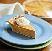 A piece of pumpkin pie with cream (USA)
