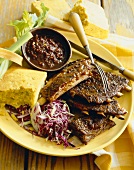 Plate of Barbeque Ribs with Cole Slaw and Corn Bread, Fork and Knife