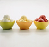Lemon, raspberry and lime sorbet in coloured bowls