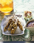 Chicken satay on glass noodles with spicy peanut sauce