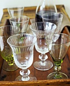 Assorted glasses on wooden tray