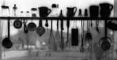 Kitchen Tools and Utensils on and Hanging from a Shelf with Farm in Background