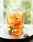 Three Glasses of Classic Ice Tea on a Tray with Spoon