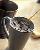 Coffee Being Poured into a Mug