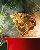Removing a Soft Shell Crab from a Pot