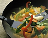 Stir Fried Vegetables Cooking in a Wok with Spatula
