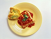 Piece of Lasagna with Garlic Bread