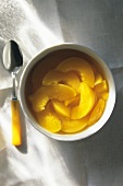 Canned Peaches in a Bowl