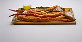 King Crab Legs on a Wooden Board with Melted Butter