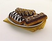 Three Eclairs with Assorted Frosting