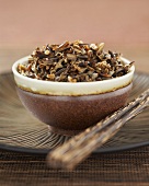 Bowl of Cooked Wild Rice with Chopsticks