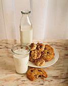 Chocolate Chip Cookies and Snickerdoodles with a Glass and Bottle of Milk