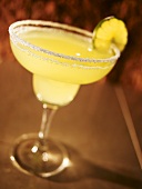 Margarita with Salt and Lime on Brown Background