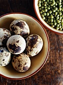 Bowl of Quail Eggs and a Bowl of Dried Peas