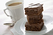 Stack of Brownies with a Cup of Coffee