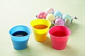 Three Cups of Easter Egg Dye, Carton of Colored Eggs