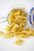 Organic Bow Tie Pasta Spilling From a Canister