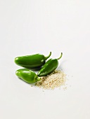 Three Jalapenos and a Pile of Sesame Seeds